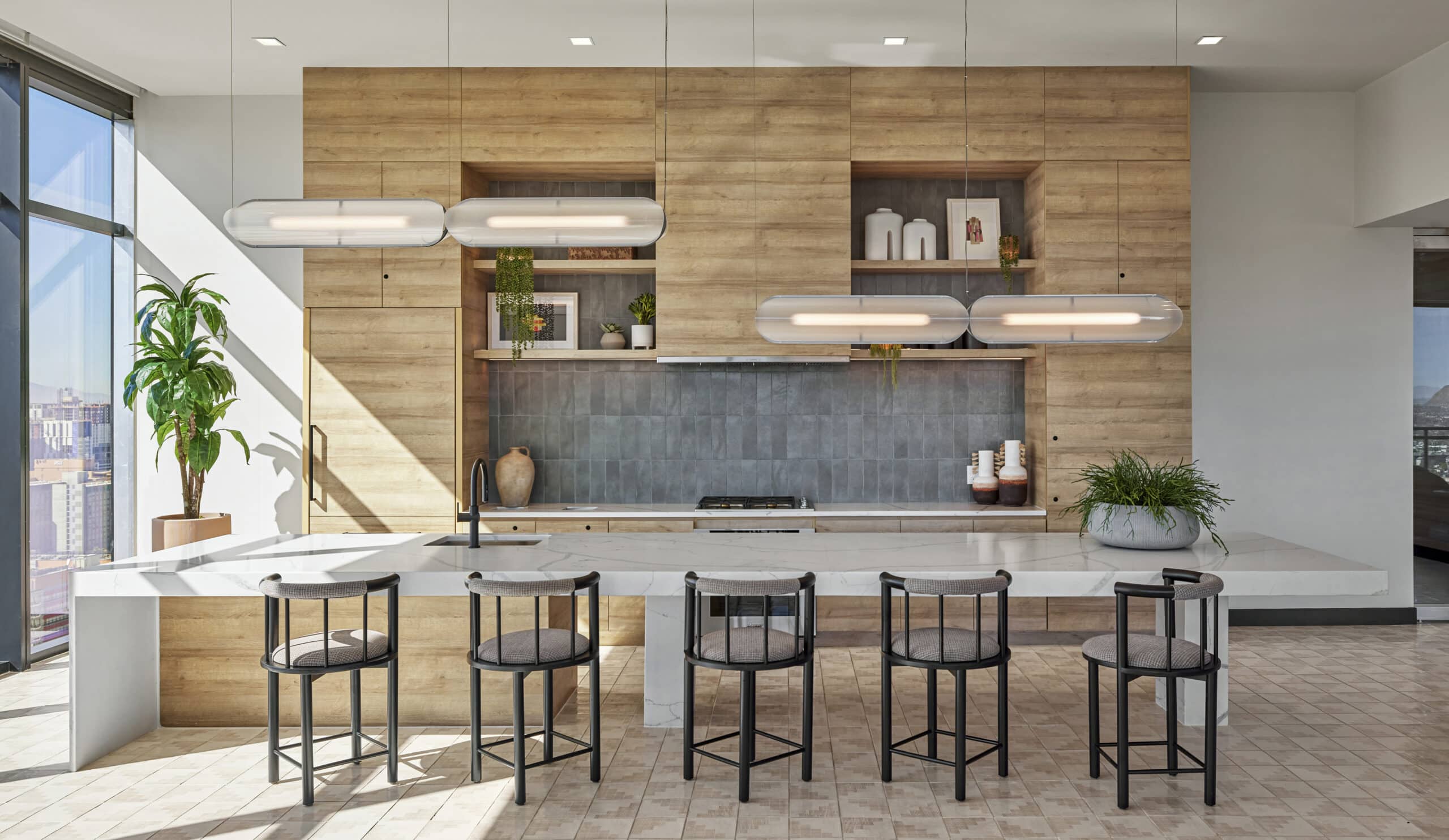 Community kitchen space with bar stools